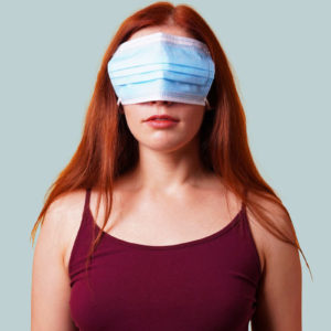 Woman with a mask covering her eyes.